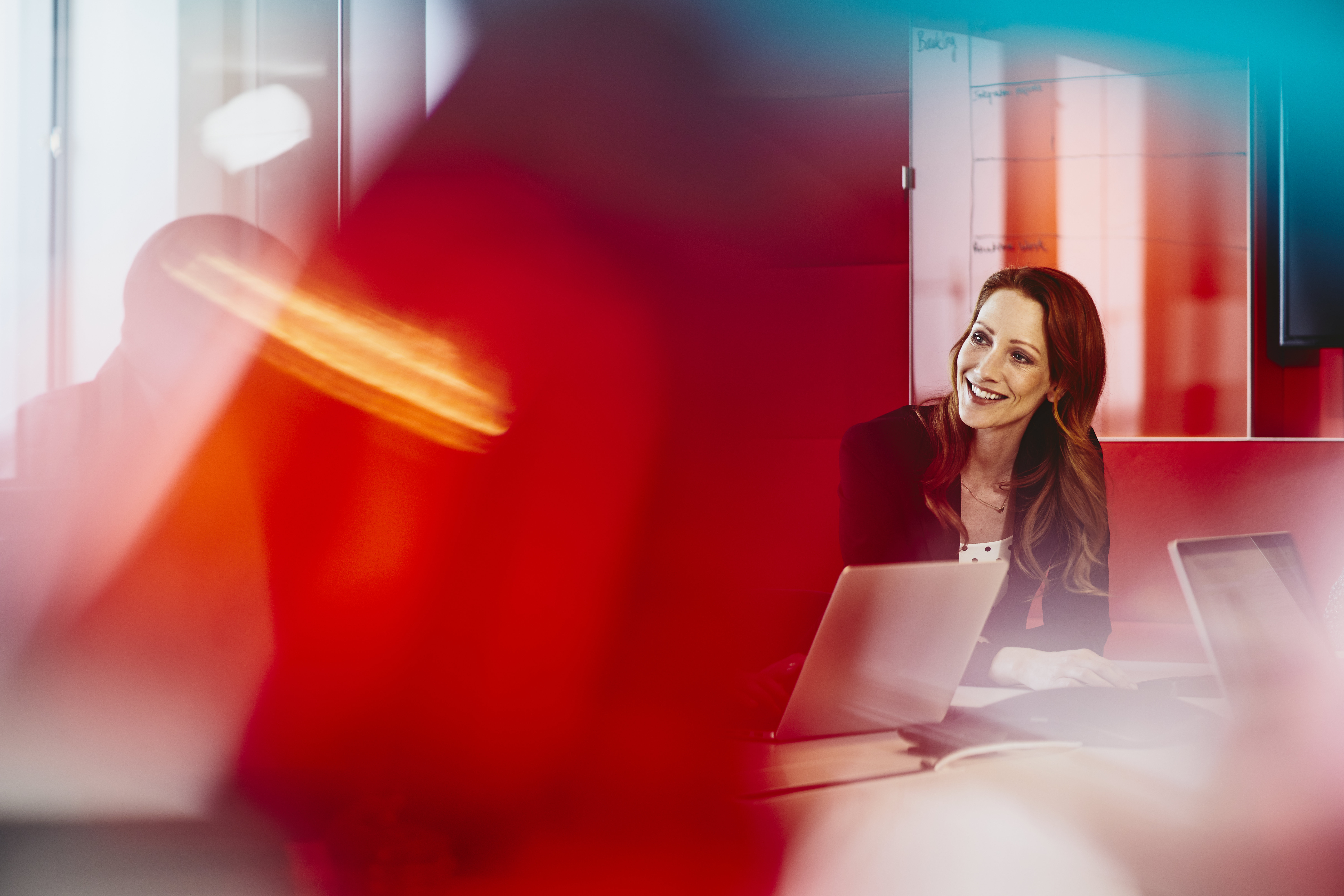 woman smiling at colleague 