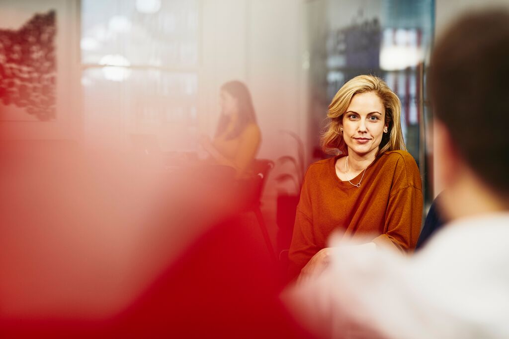 Woman smiling at a man