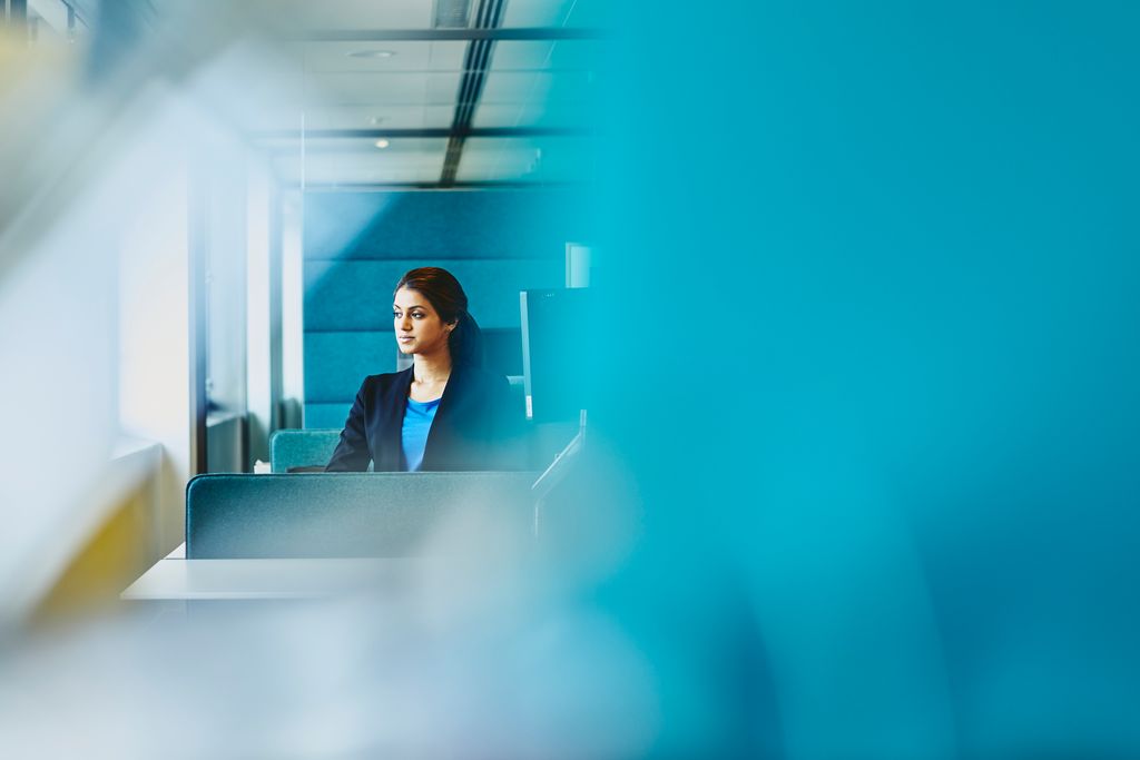 A photo of a woman using her laptop looking for a job