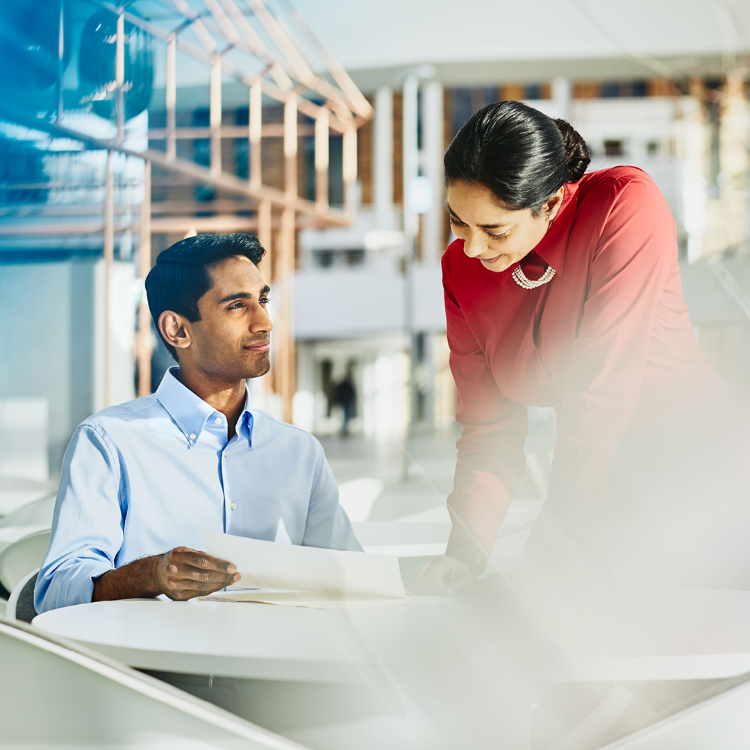 A woman and man working in the banking & finance