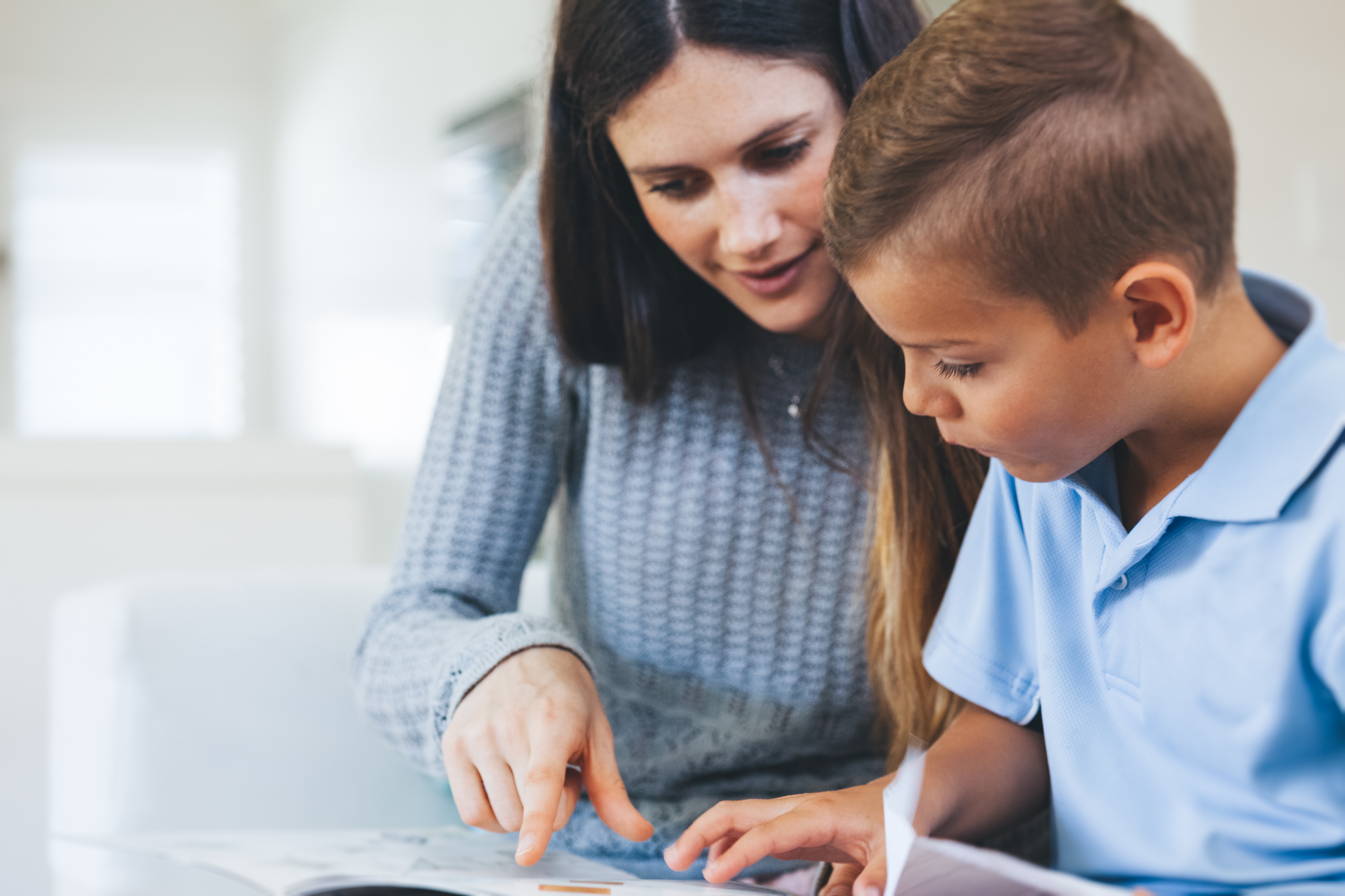 woman teaching child in educational setting