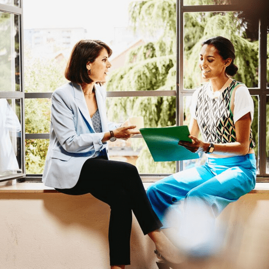 Two women working in the digital sector