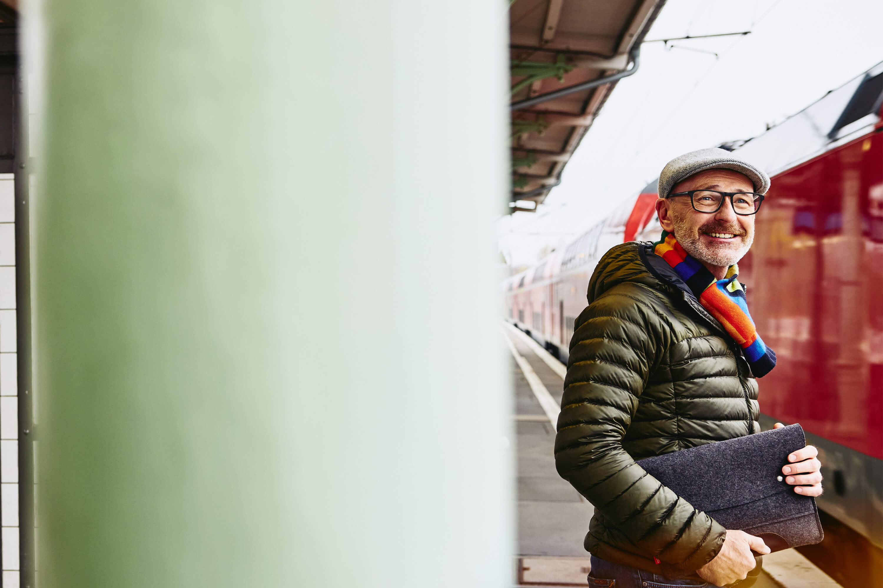 A man waiting on the train platform