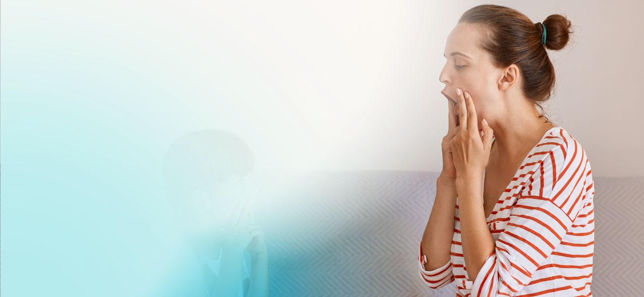 image of a speech pathologist illustrating a mouth movement with a patient