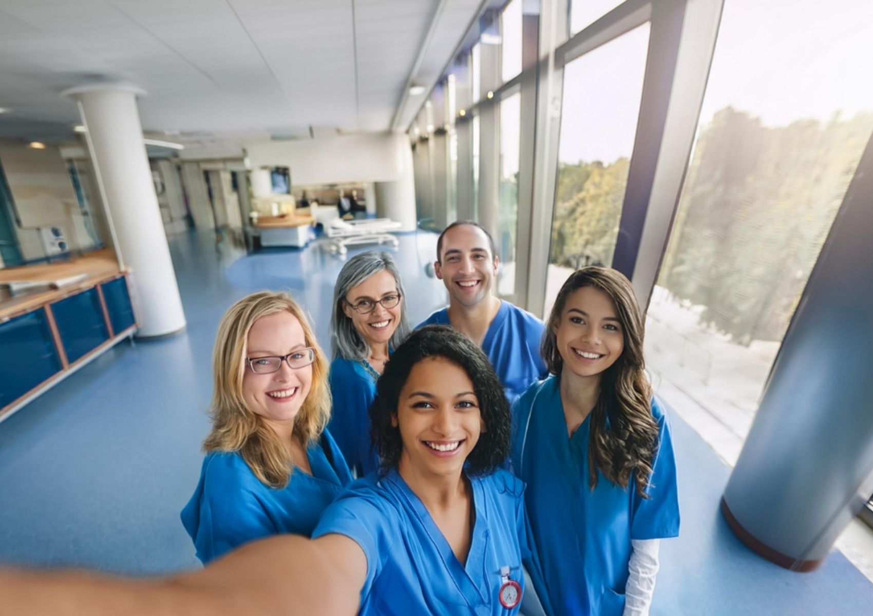 an image of nurses and doctors in scrubs smiling