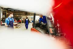three people working in a manufacturing factory