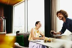  A man and woman having coffee