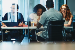 group of colleagues sitting in a meeting room