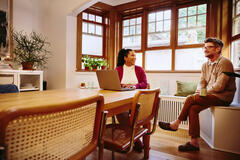 two people talking in an office setting
