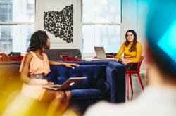 A photo of two women having a conversation about searching for learning support officer and teachers’ aide jobs