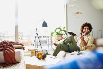 A man in the living room working remotely