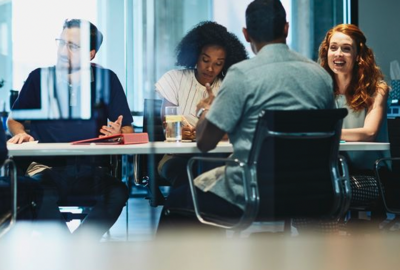 group of colleagues sitting in a meeting room