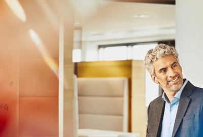 man smiling at his coworker