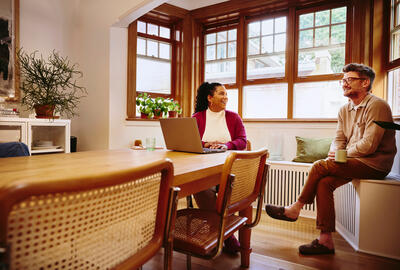 two people talking in an office setting