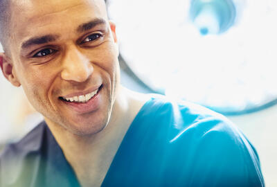 A male nurse smiling
