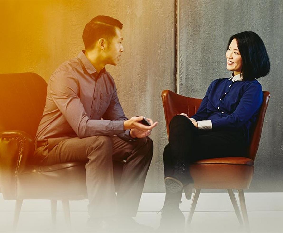 A man and woman engaged in a conversation