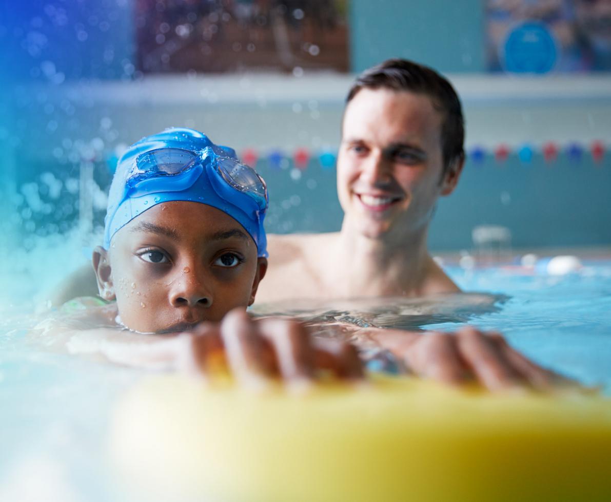 an image of a man teaching a kid how to swim an image of a man teaching a kid how to swim