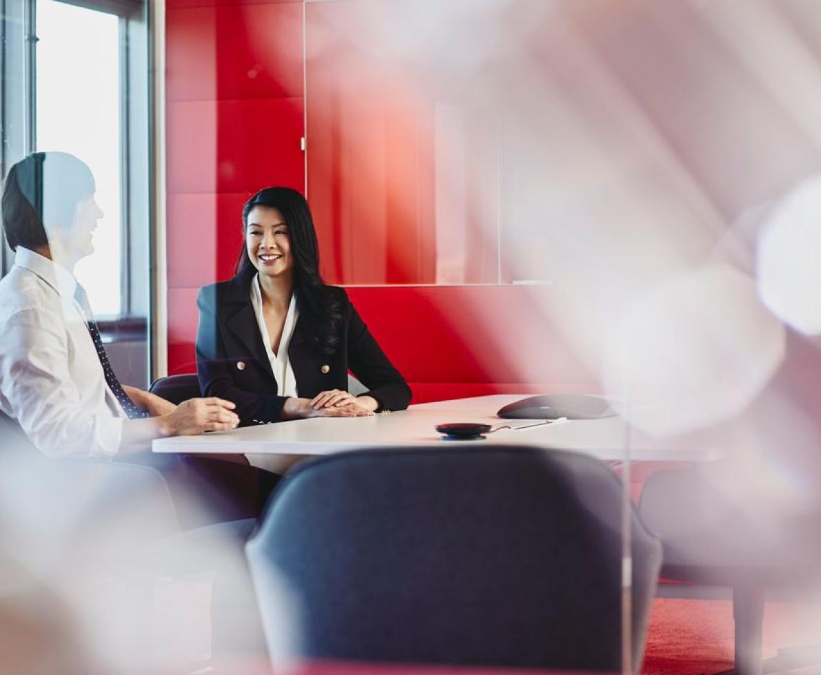 Man and woman talking in an office