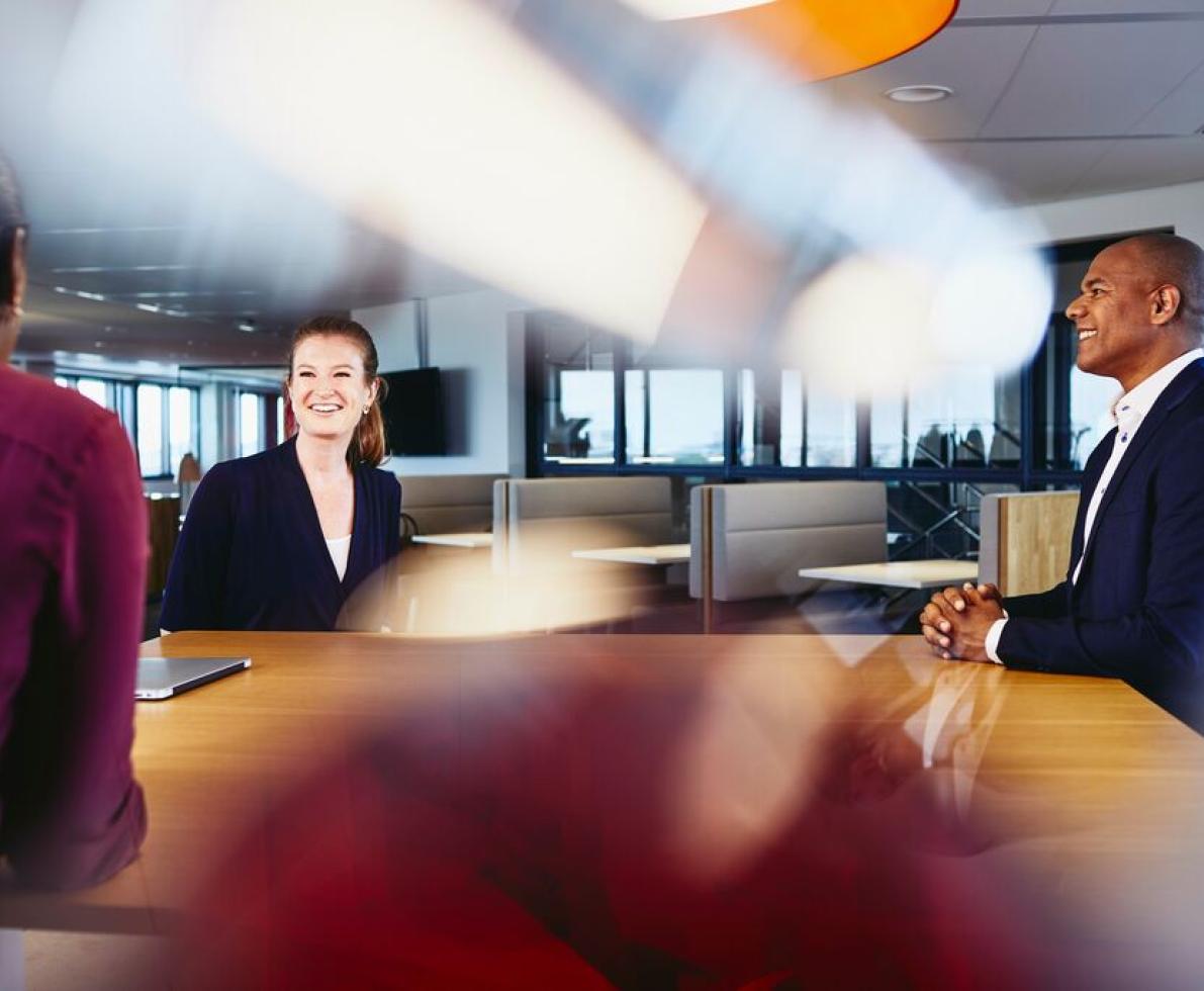 A photo of a man and a woman working as transport planners in an office