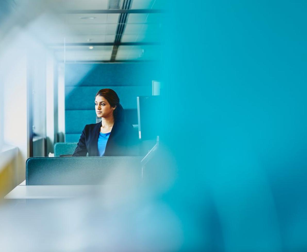 A photo of a woman using her laptop looking for a job