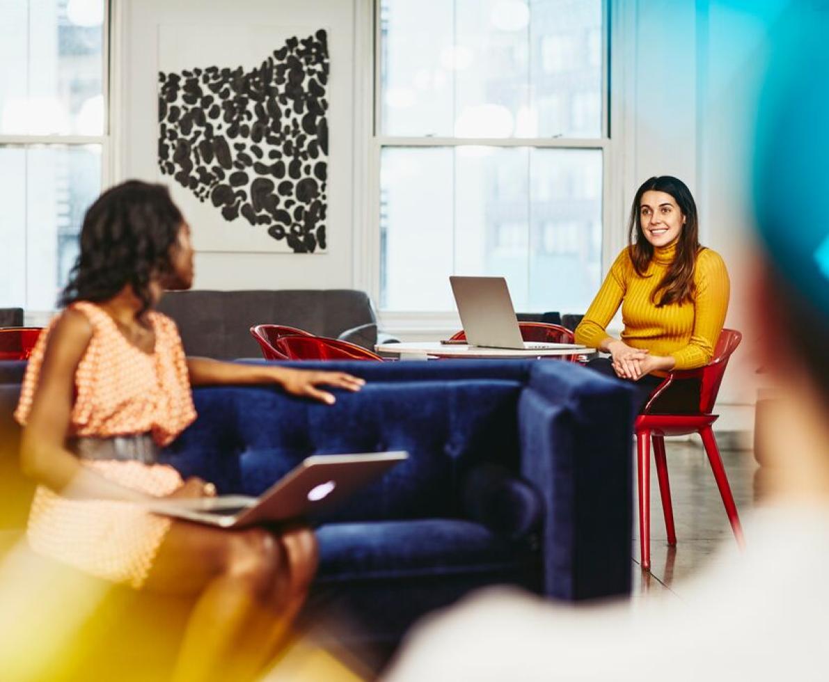 A photo of two women having a conversation about searching for learning support officer and teachers’ aide jobs