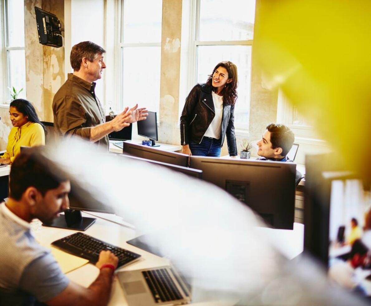 A photo of a group having a conversation working as software engineers