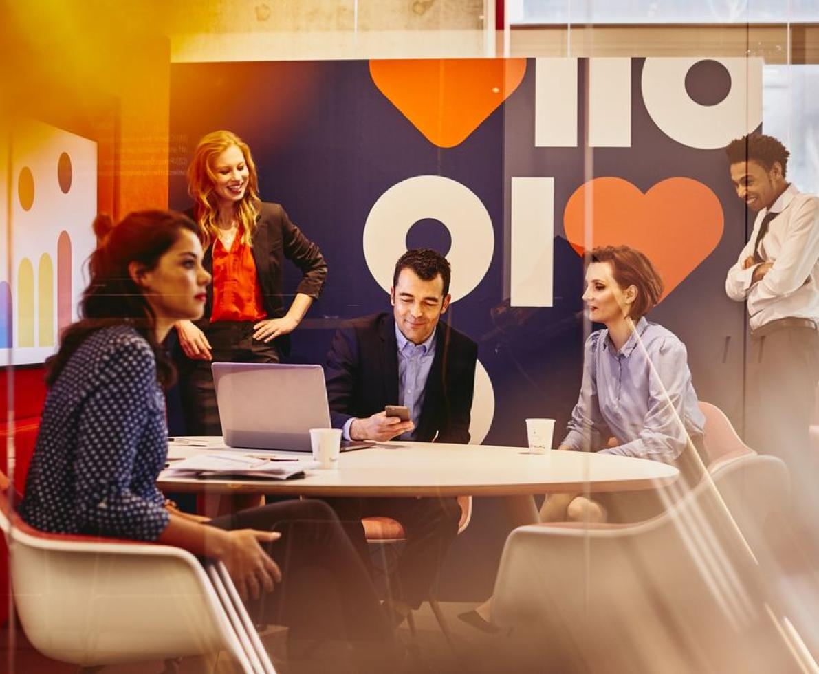 A group of people in a meeting