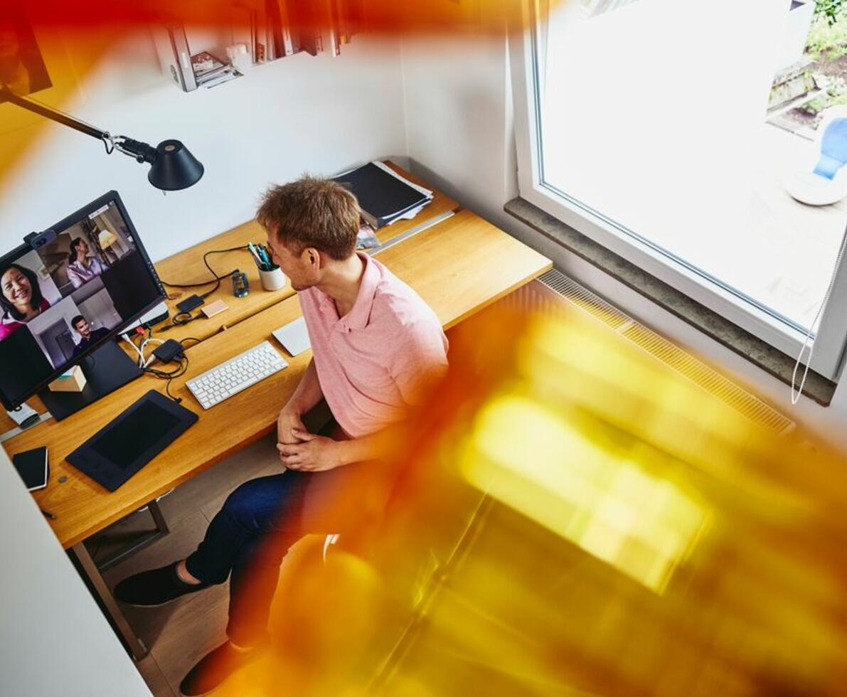 A photo of a man working remotely