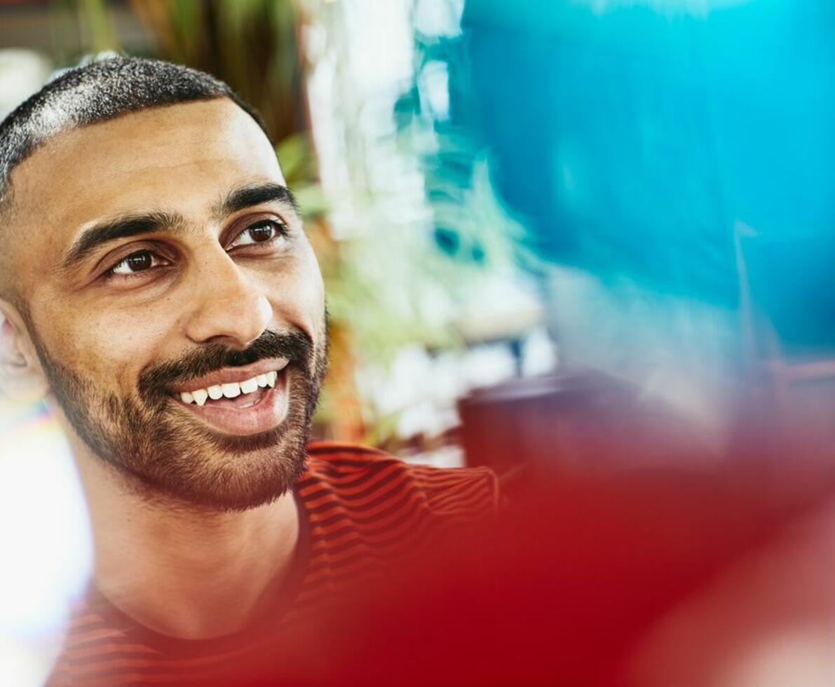 close up - smiling man looking away