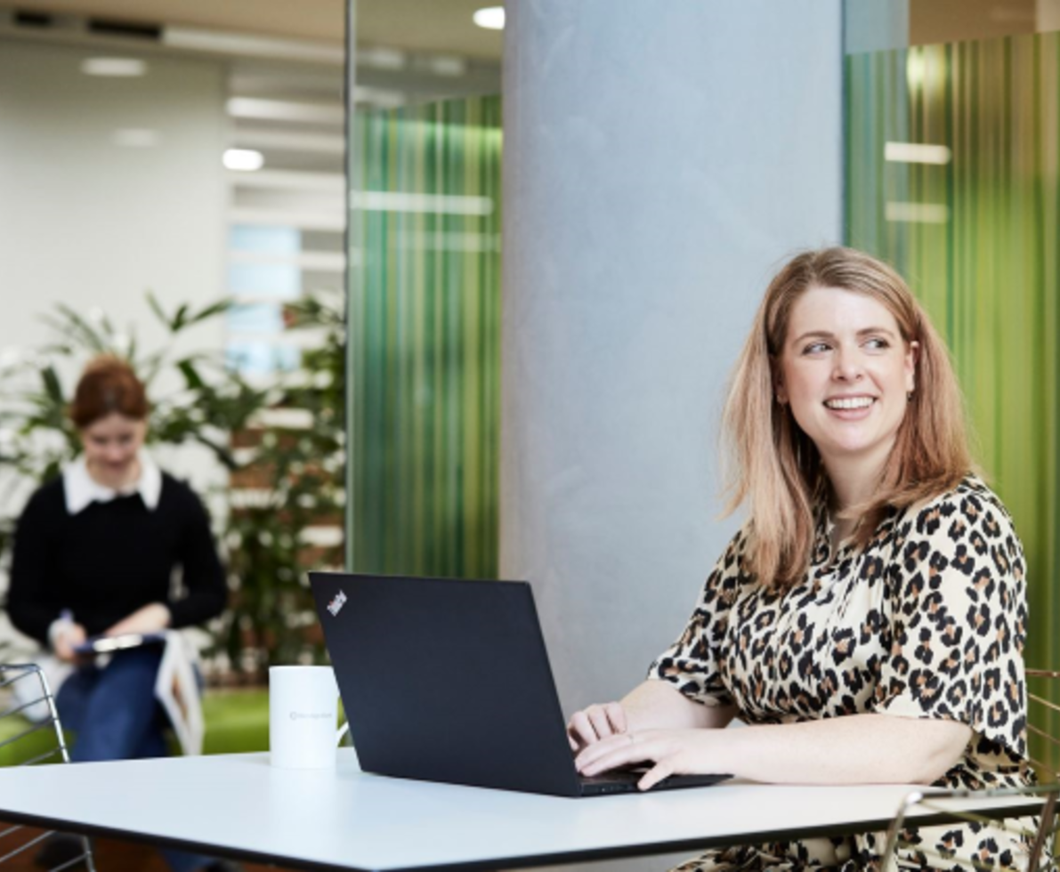 lady with laptop smiling 