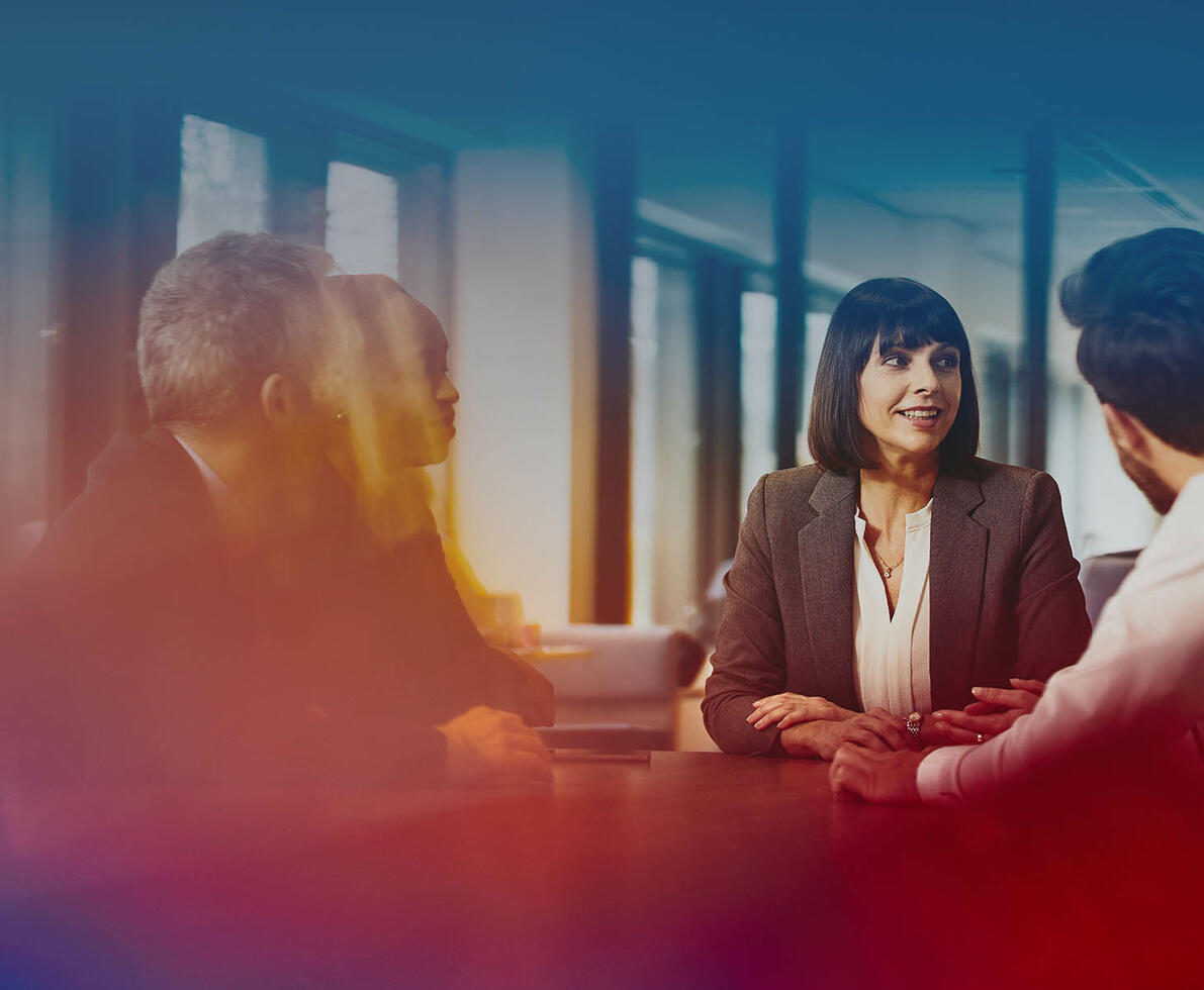 group of professionals have a meeting in an office