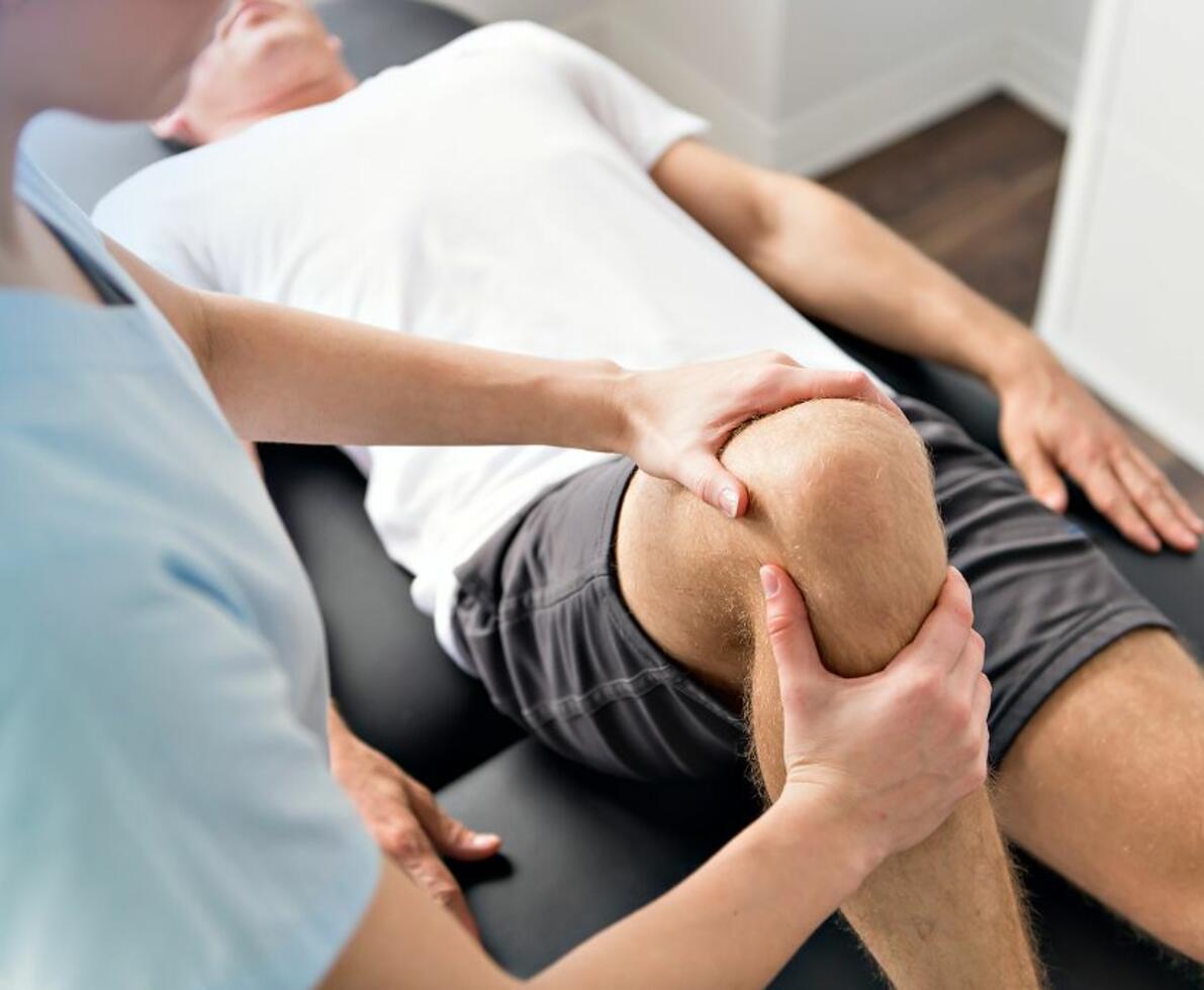 occupational therapist working on a patients knee