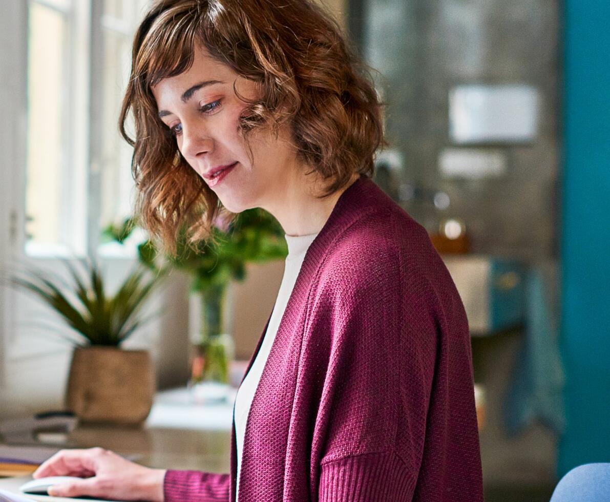 image of a woman looking at some papers in an office setting