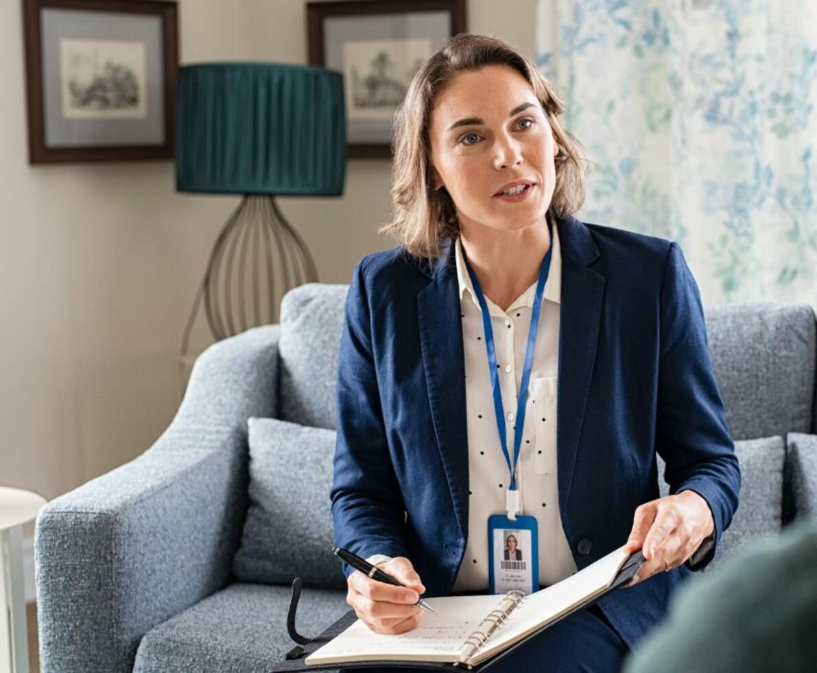 image of a social worker talking with a patient