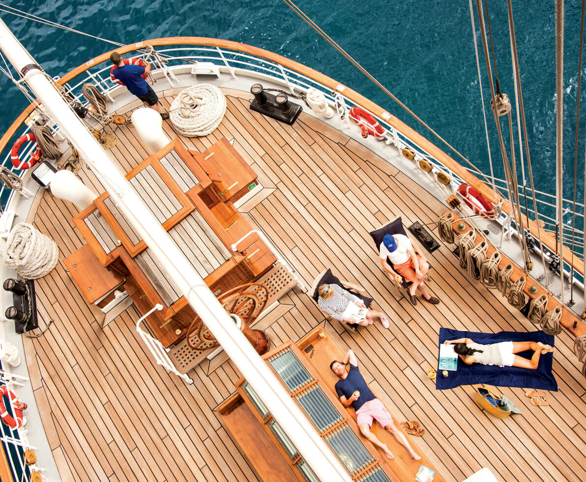 an image of the deck of the clipper ship with people on board
