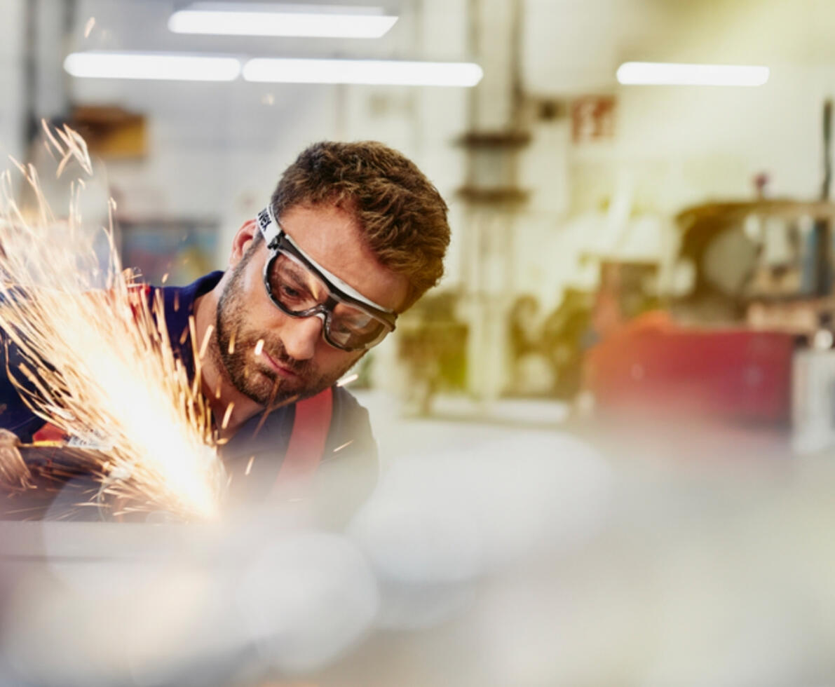 an image of a man wearing safety glasses while welding