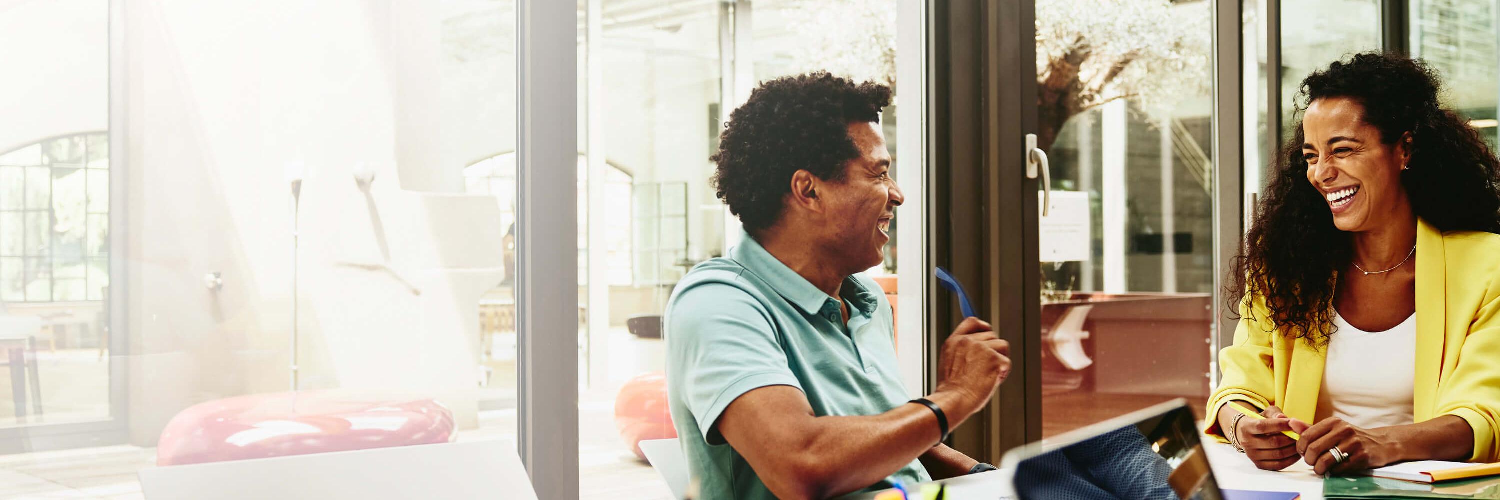 A photo of two people working