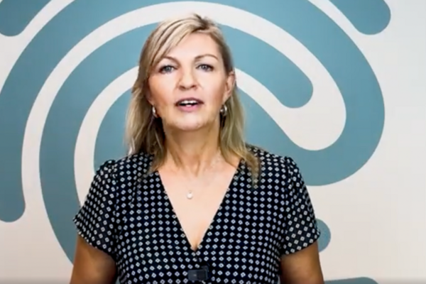 woman with blonde hair talking to the camera