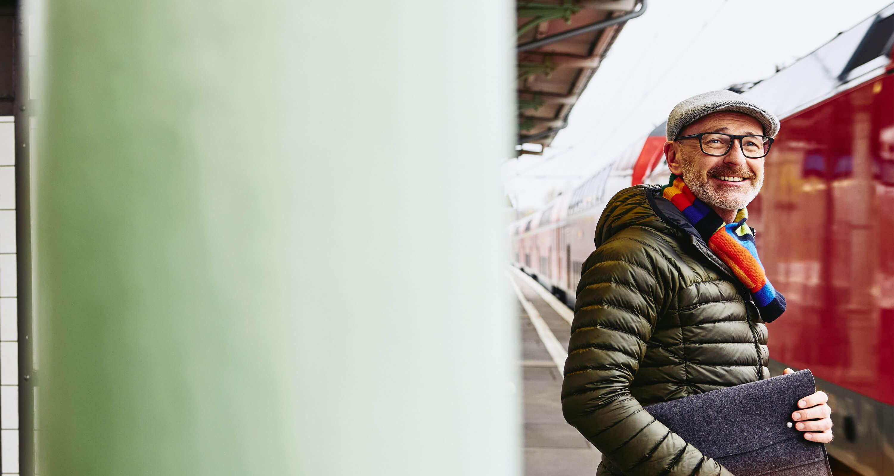 A man waiting on the train platform