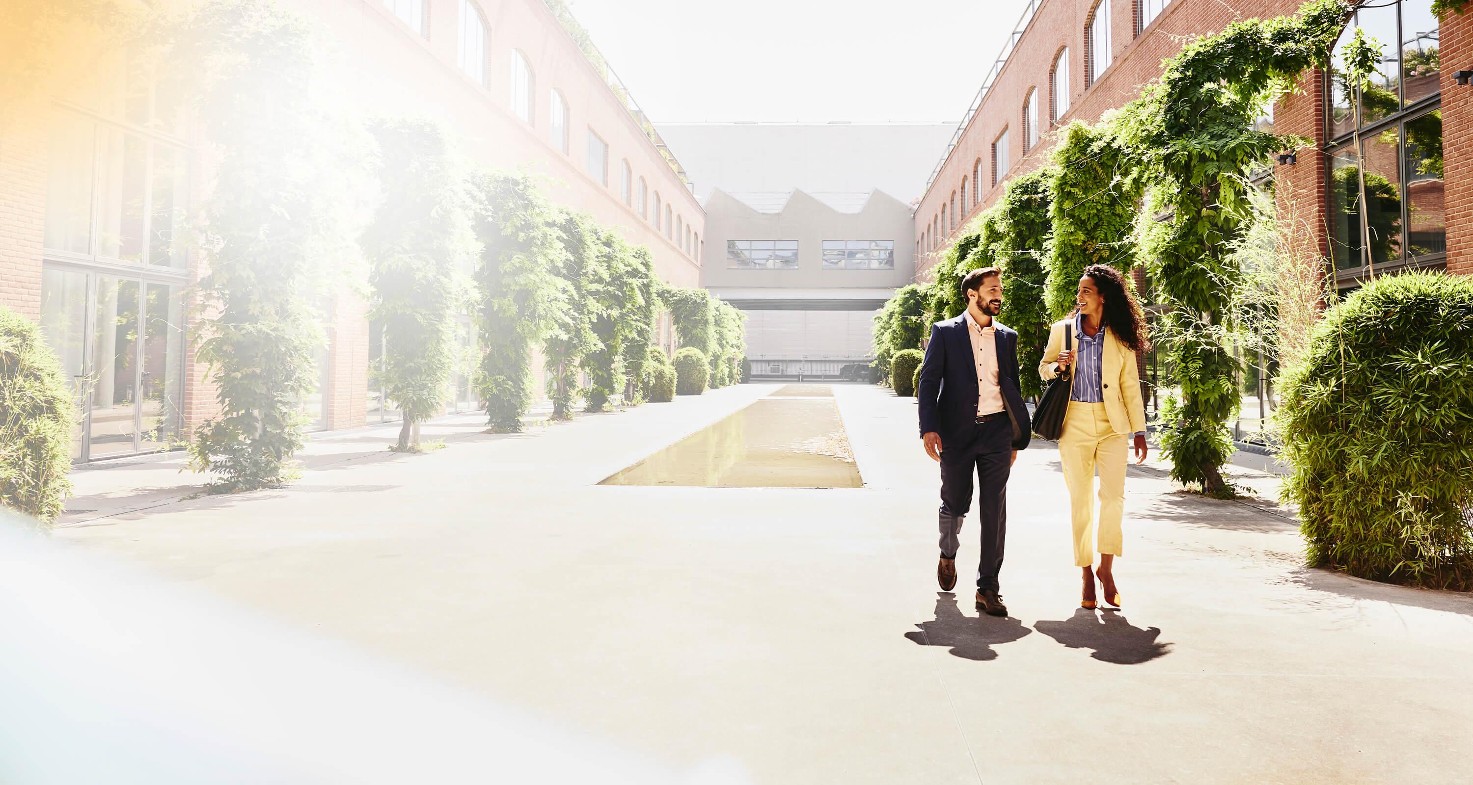 A photo of two people walking 