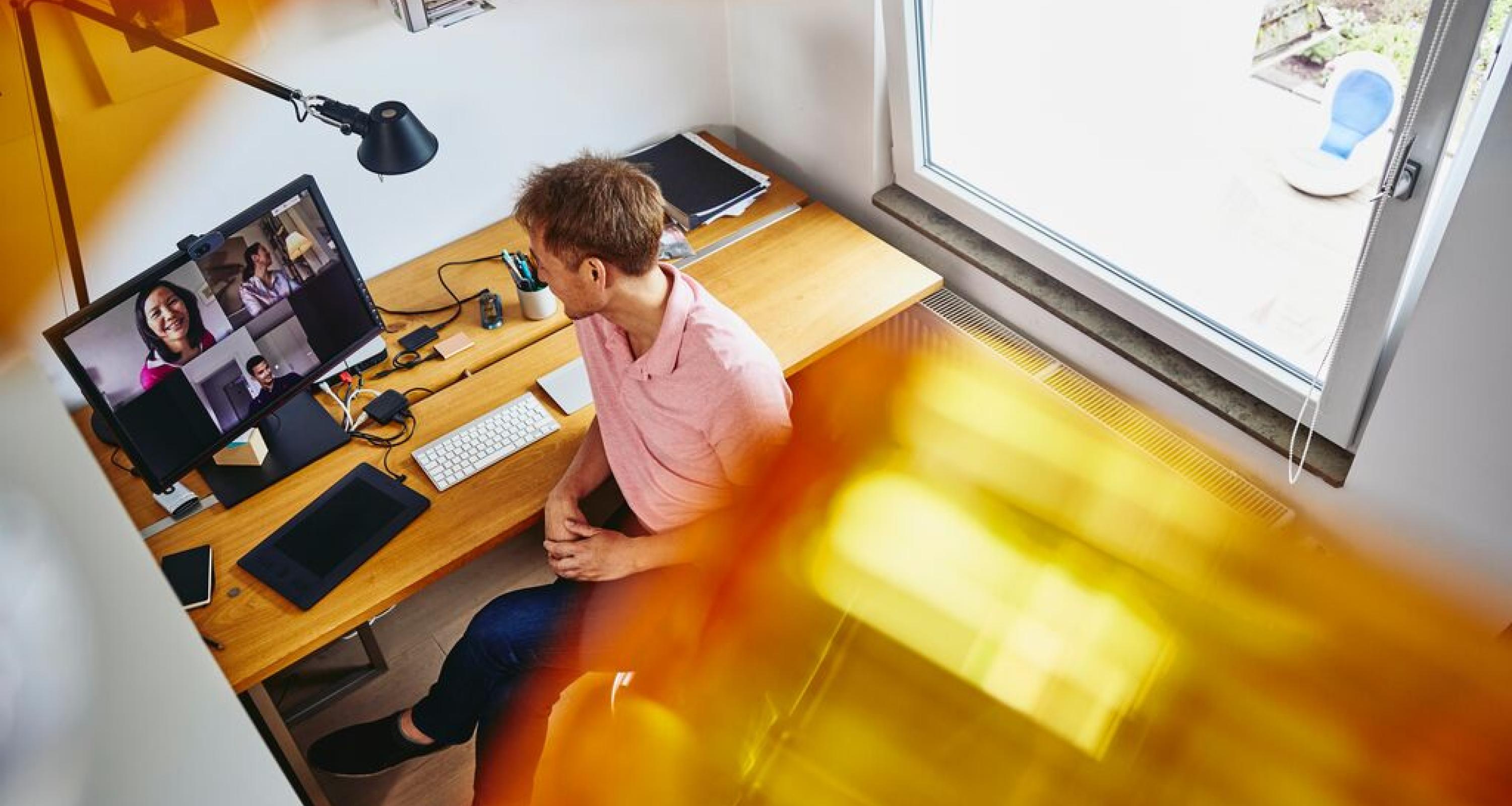 A photo of a man working remotely