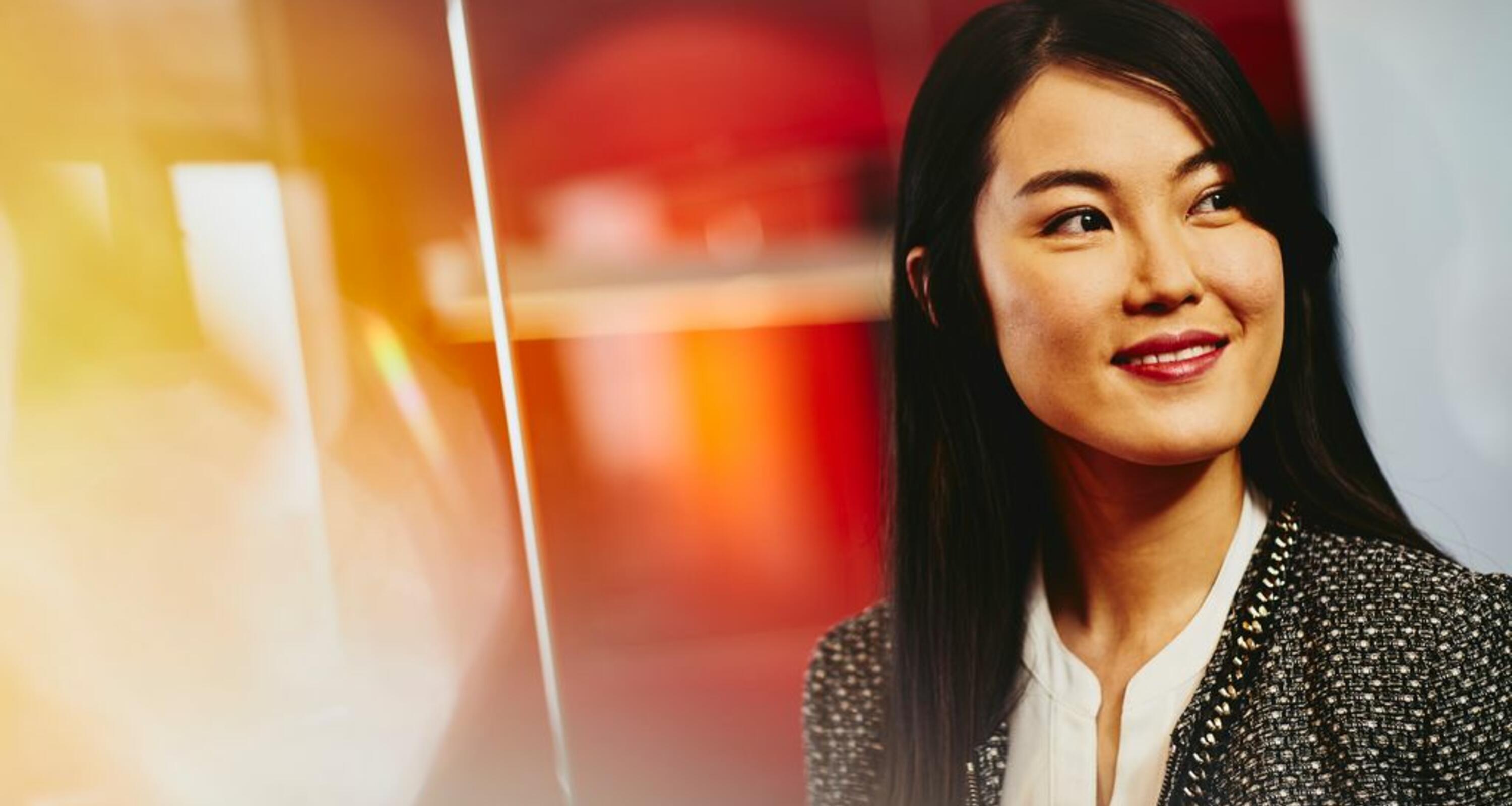 close up - smiling woman looking away
