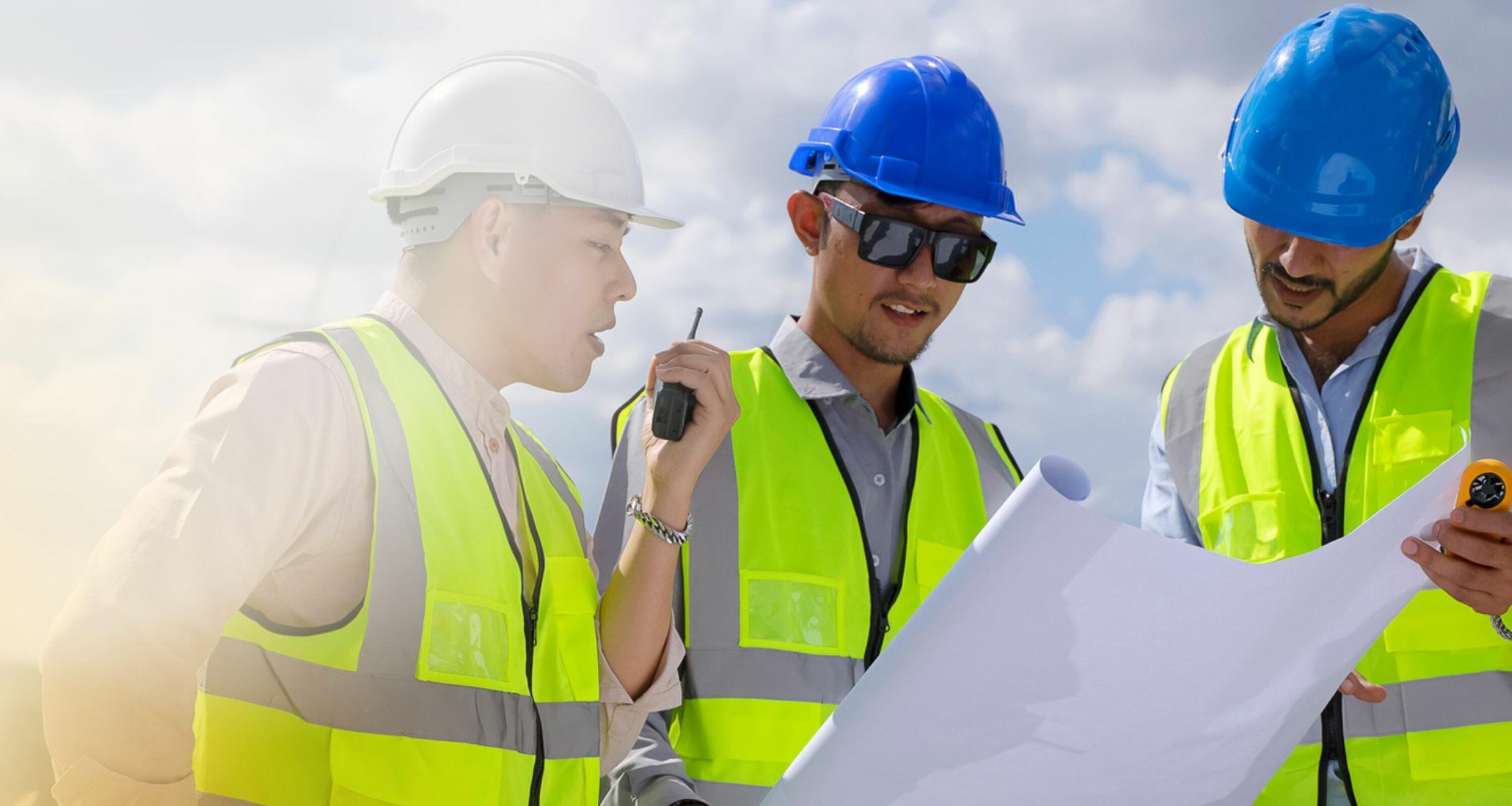 engineering colleagues working in high vis