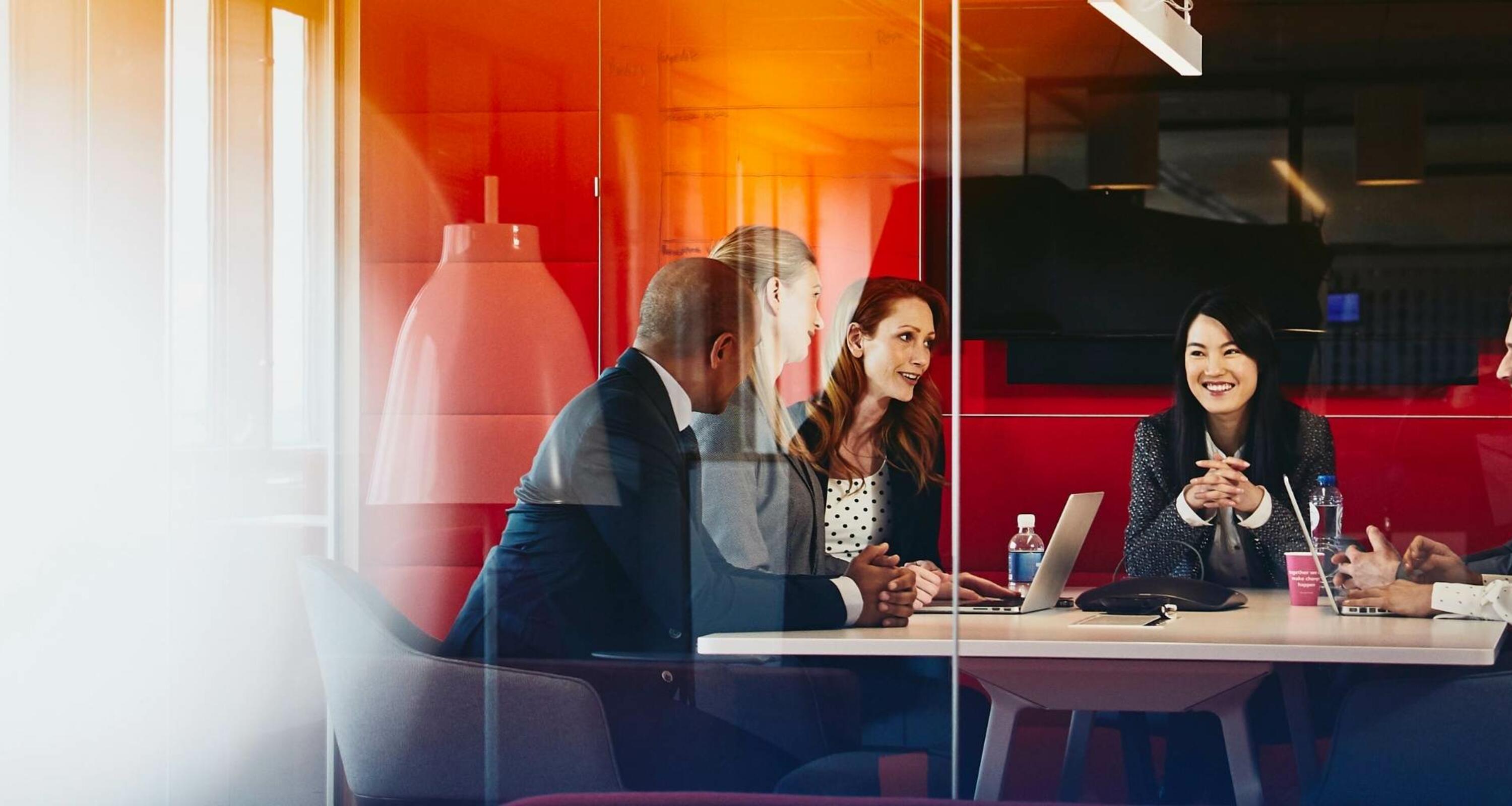 group of workers in a meeting in an office group of workers in a meeting in an office
