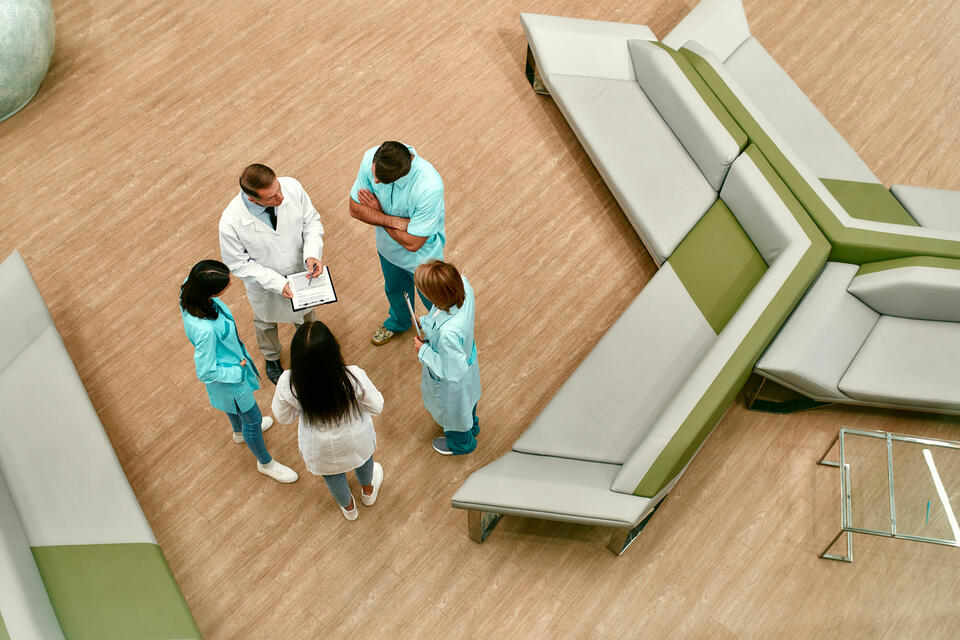 A group of doctors and nurses in a lobby