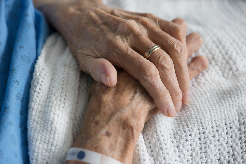 image of a patient hands wearing a medical bracelet