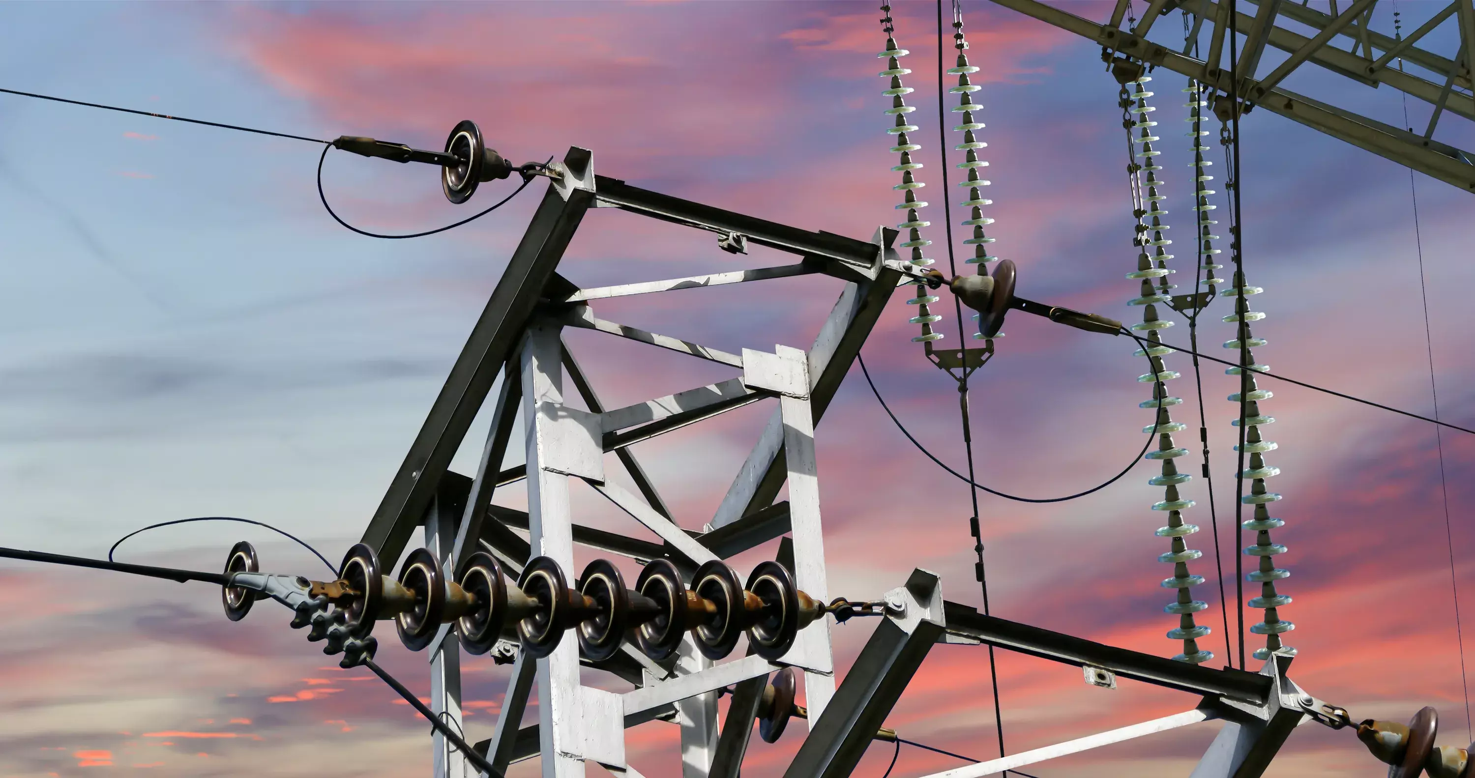 Electricity pylon (high voltage power line) against the background of an evening sky.