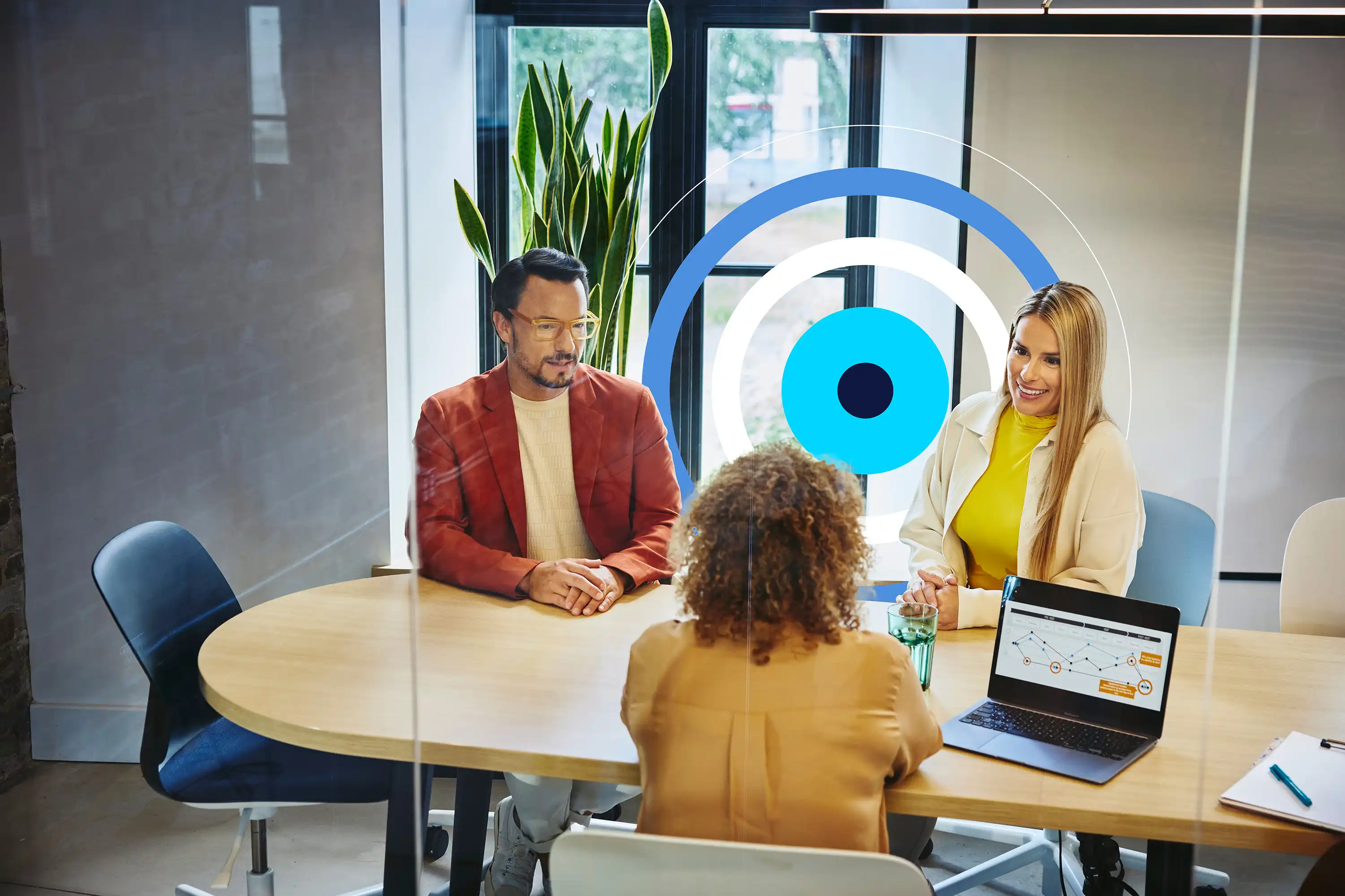 an image of two people interviewing someone in a meeting room