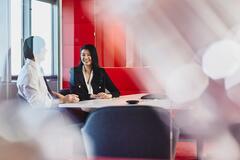 Man and woman talking in an office