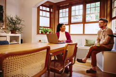 two people talking in an office setting